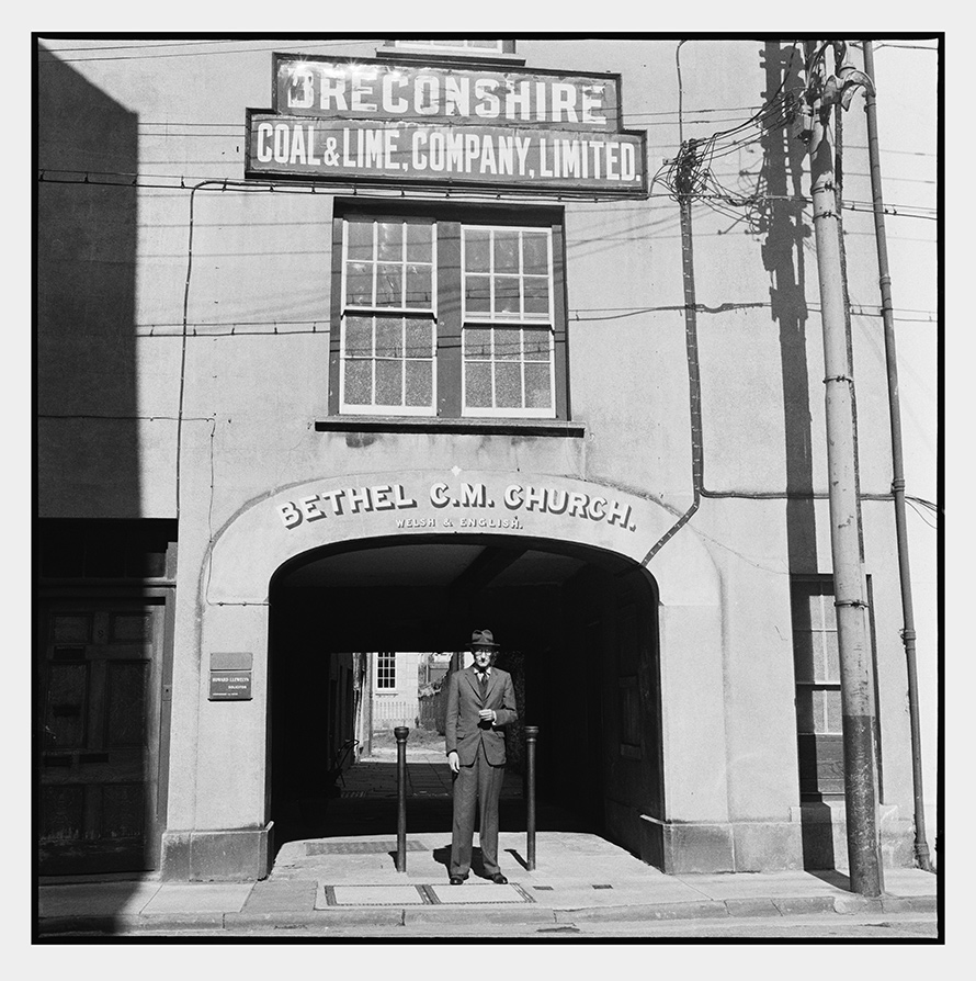 Harriet Crowder: Man Standing at Bethel Square, Lion Street, Brecon, Wales (William S. Burroughs, 1960)